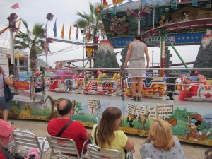 Carnival ride at Blanes. Nice consideration to have chairs for the parents as they watch their children.